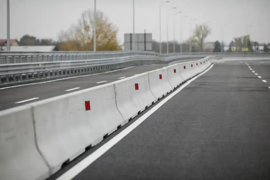 A long stretch of Jersey barriers on an interstate highway