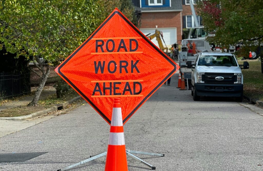 A “Road Closed” sign on a road under construction, one of the many types of construction signs