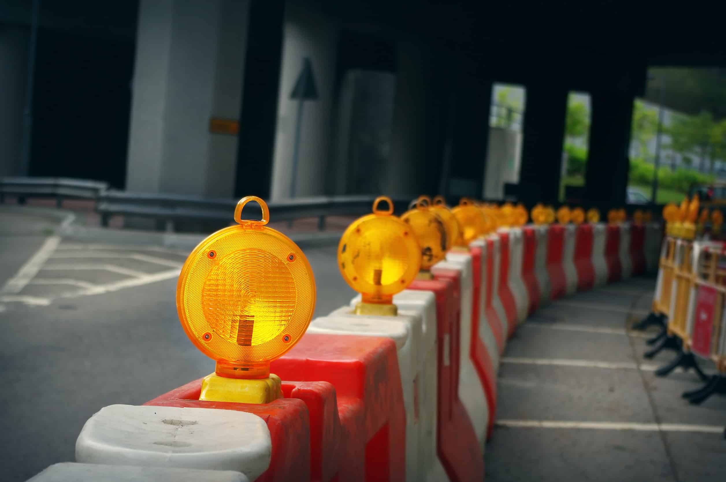 A temporary construction barricade with reflective lights