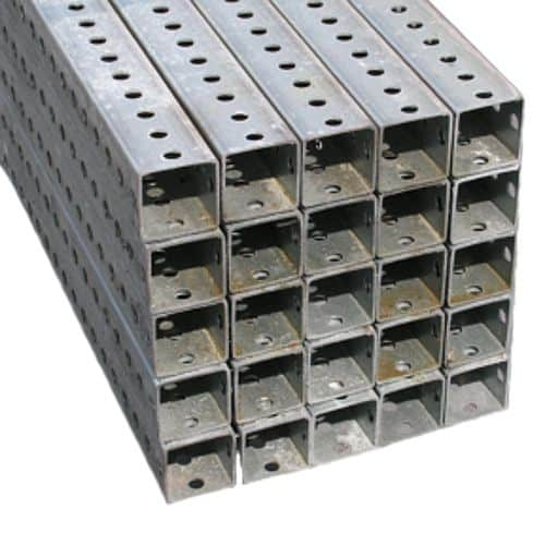 A stack of galvanized breakaway sign posts